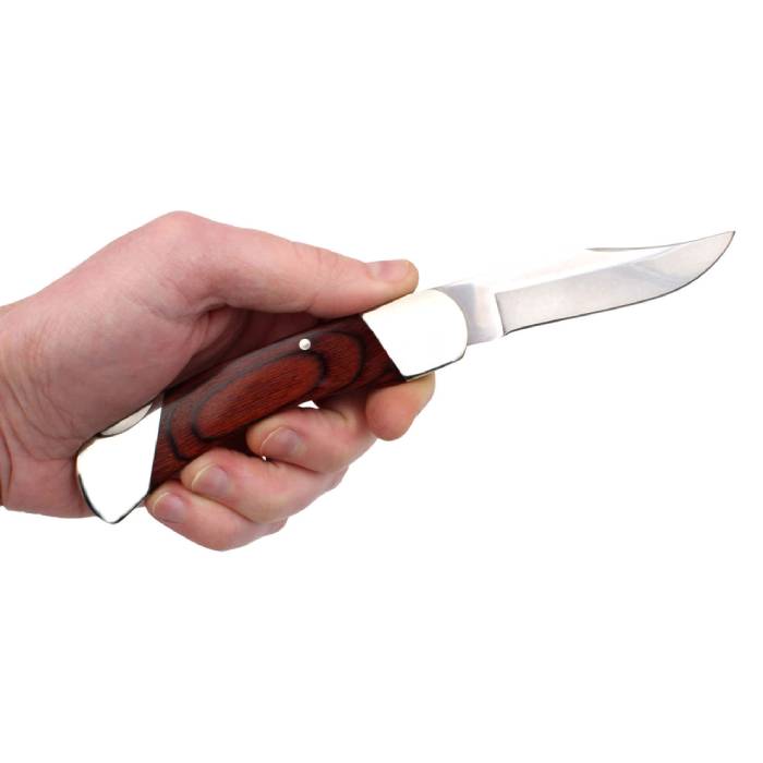 Hand holding Bear & Son 97 lockblade knife