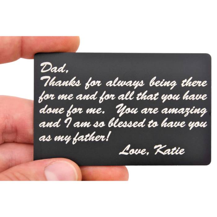 man holding an engraved wallet card