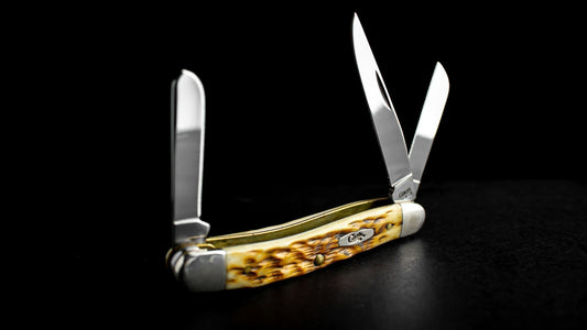 case pocket knife on a black surface