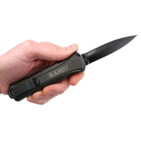 man holding an engraved black pocket knife