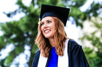Woman wearing graduation hat and gown