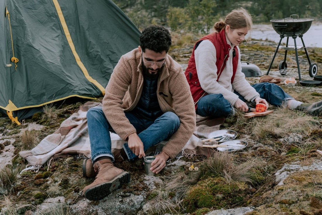 man and woman camping together