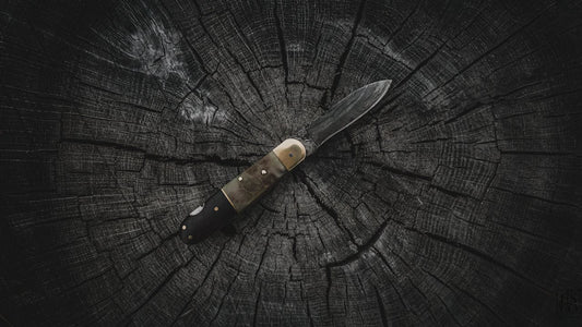Folding knife on a stump