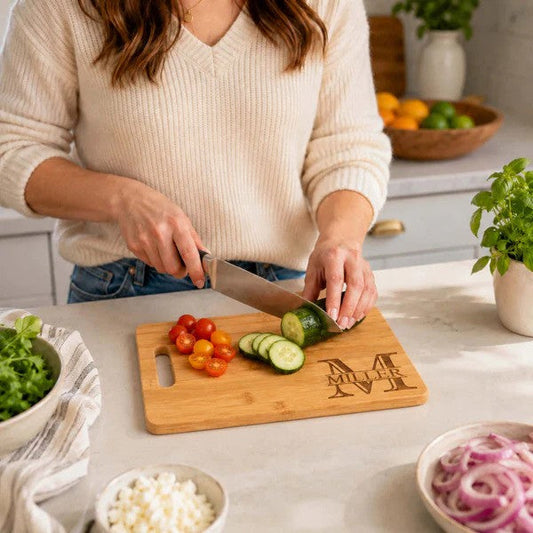 Woman chopping veggies on a custom cutting board
