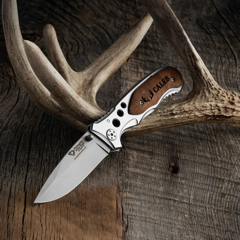 pocket knife stuck sitting on an antler