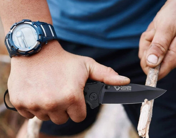 man carving a stick with a pocket knife