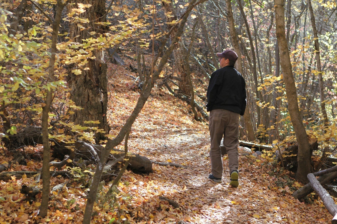 a man standing in woods