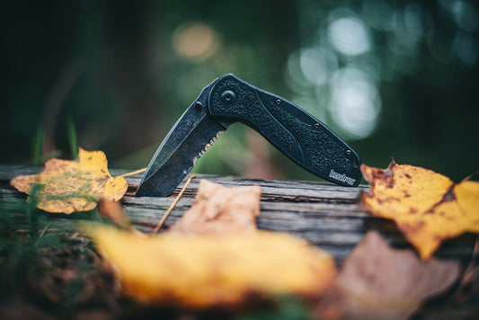 folding knife of a wooden log