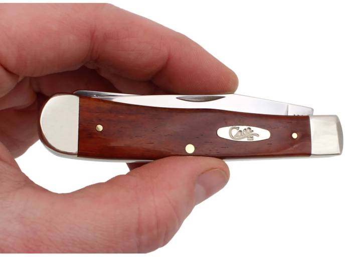 man holding a trapper case knife