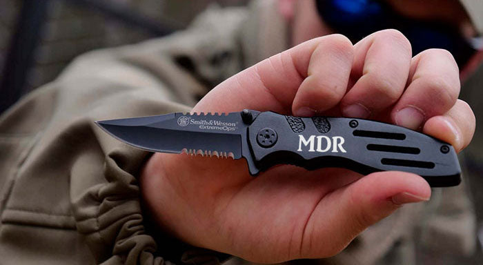 man holding a smith and wesson extreme ops custom pocket knife